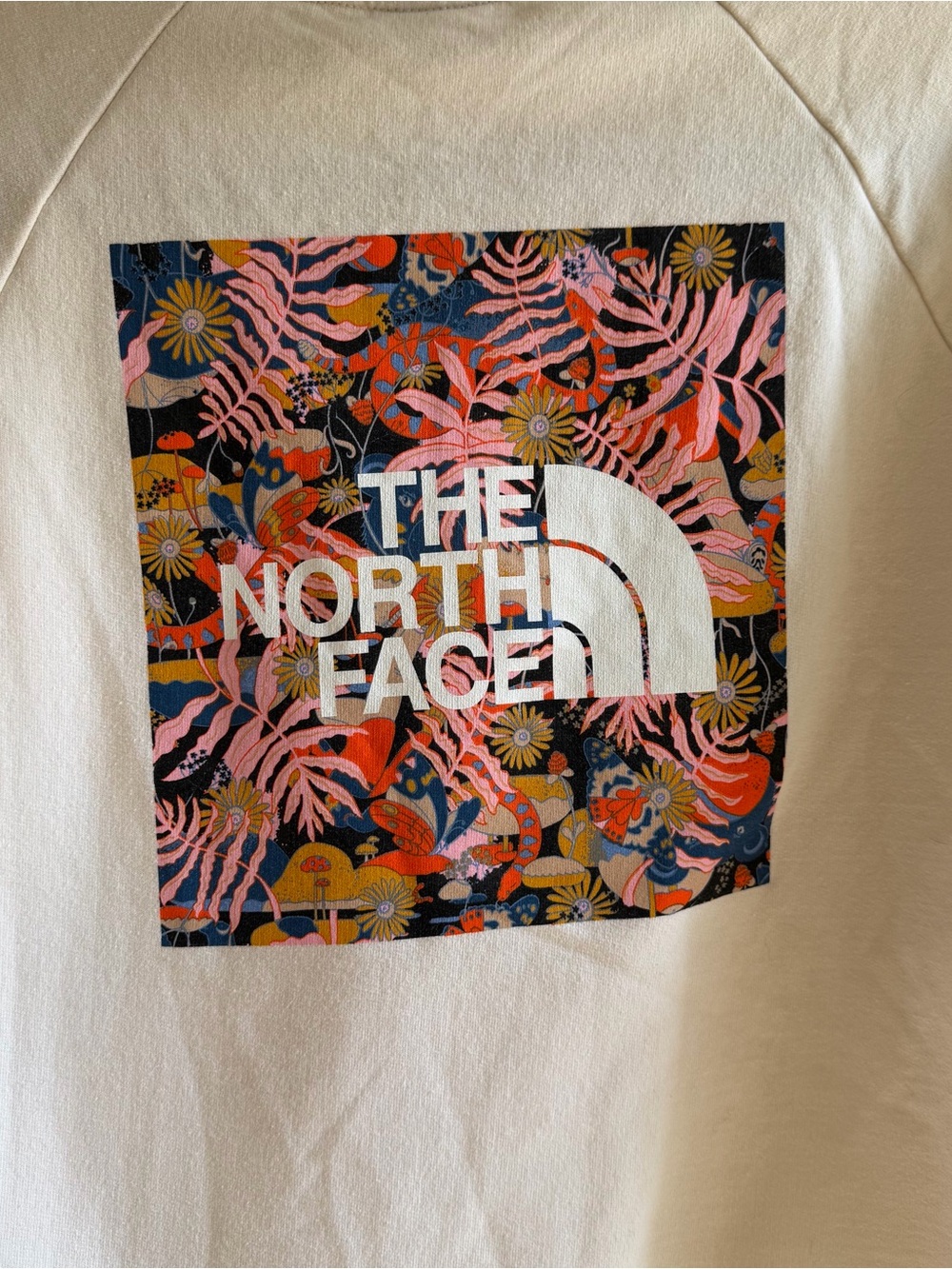 The North Face Cream Sweatshirt with Floral Logo Patch
